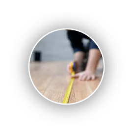 Man measuring floor | Holmes Carpet Center